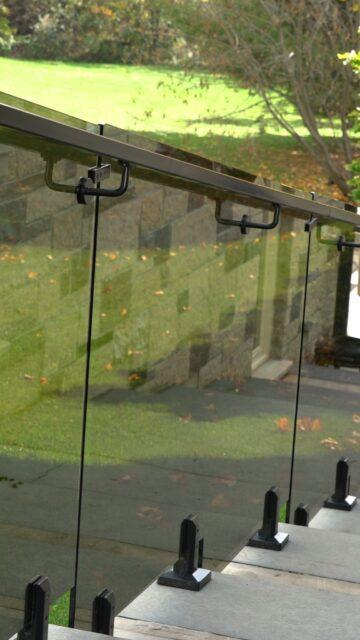 Frameless Tinted Railings with Handrails #FramelessGlassRailings #TintedGlass #ArtMetalWorkshop #BalconyRailing #ModernDesign #TorontoFabrication #GlassAndMetal #ArchitecturalDetails #CustomRailing #MadeInCanada