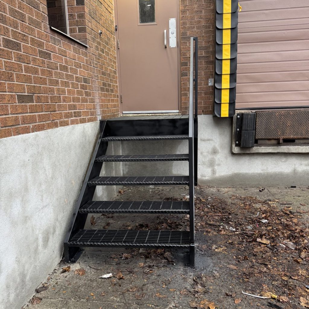 garage-steel-stairs-narrow-exit-steel-steps-brick-wall